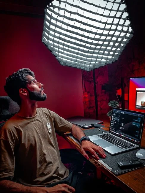 A person using a laptop to browse stock photo websites. Freelancing work in a cozy setting.
